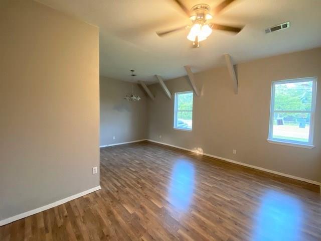 3113 Farm To Market Road 131 Denison, TX 75020 - Photo 5 of 11 wooden floor in an empty room with a window