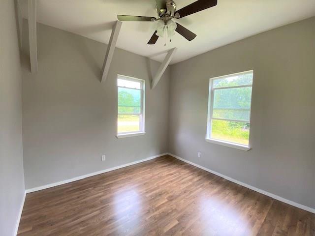 3113 Farm To Market Road 131 Denison, TX 75020 - Photo 6 of 11 a view of empty room with wooden floor and fan