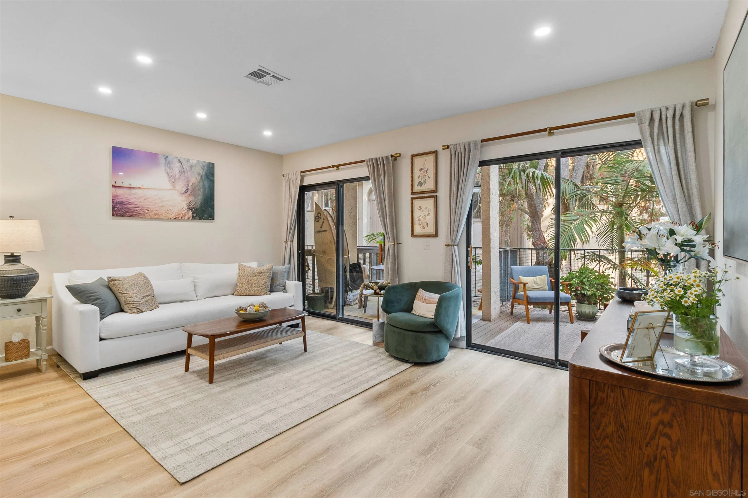 2383 Altisma Way, Unit B Carlsbad, CA 92009 - Photo 1 of 38 a living room with furniture and a large window