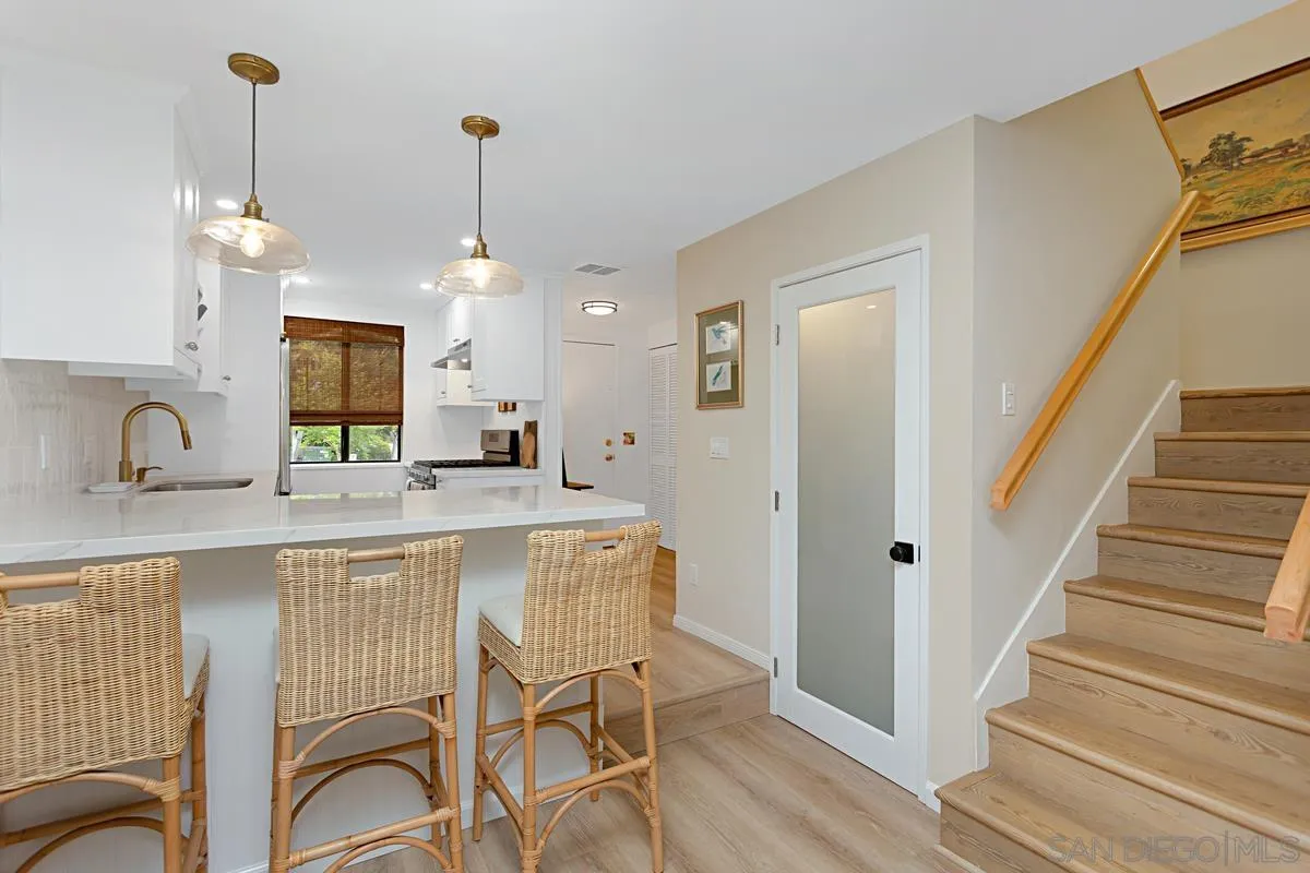 2383 Altisma Way, Unit B Carlsbad, CA 92009 - Photo 15 of 38 a view of a kitchen from the dinning room and windows