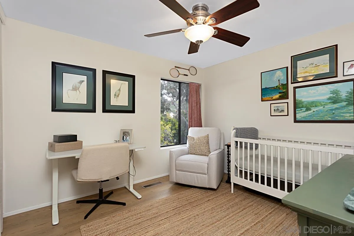 2383 Altisma Way, Unit B Carlsbad, CA 92009 - Photo 18 of 38 a bedroom with a bed and a window