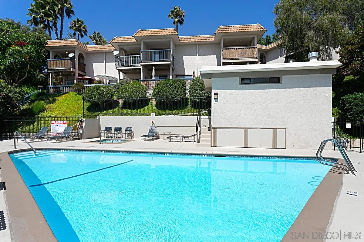 2383 Altisma Way, Unit B Carlsbad, CA 92009 - Photo 26 of 38 a view of a house with pool and chairs
