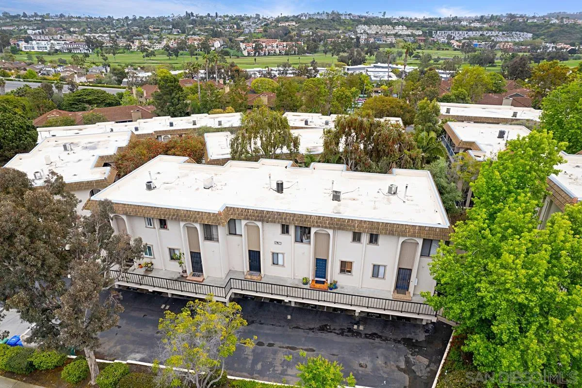 2383 Altisma Way, Unit B Carlsbad, CA 92009 - Photo 28 of 38 an aerial view of a house with a garden and lake view