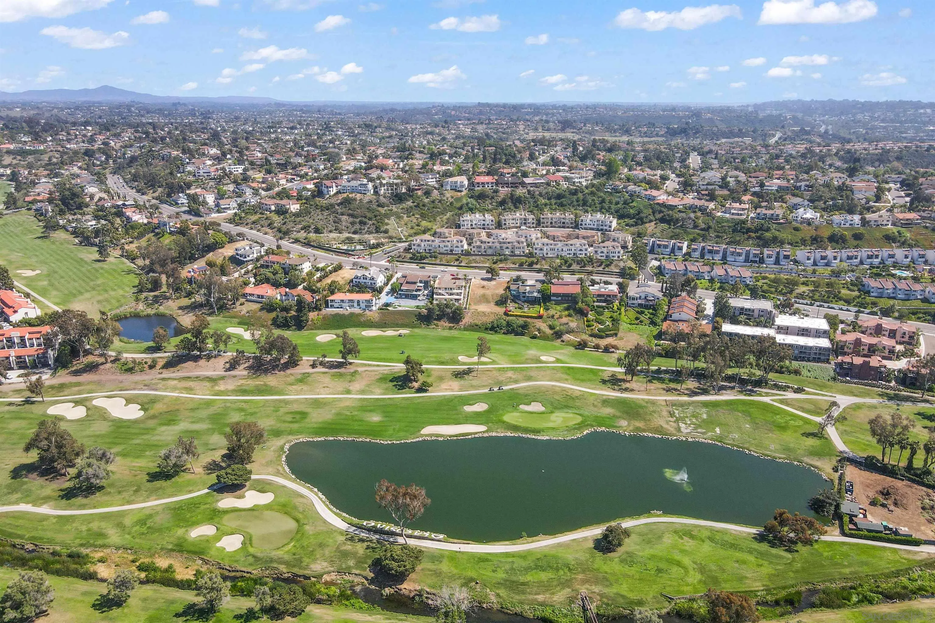 2383 Altisma Way, Unit B Carlsbad, CA 92009 - Photo 31 of 38 an aerial view of a houses with a outdoor space