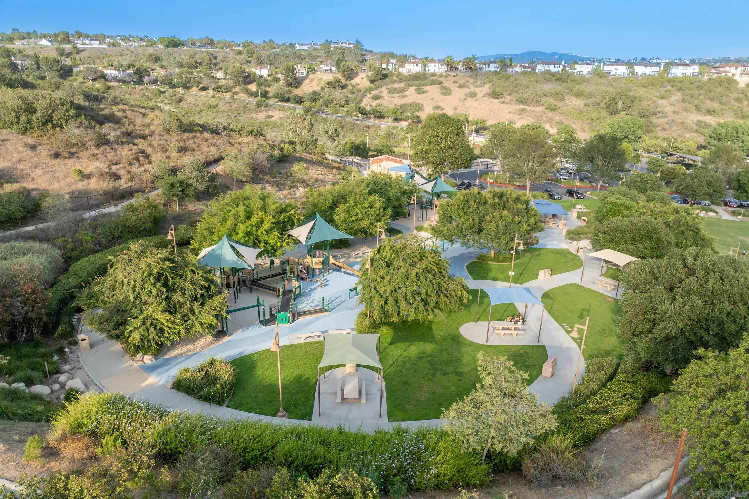 2383 Altisma Way, Unit B Carlsbad, CA 92009 - Photo 34 of 38 an aerial view of a house with a yard and lake view