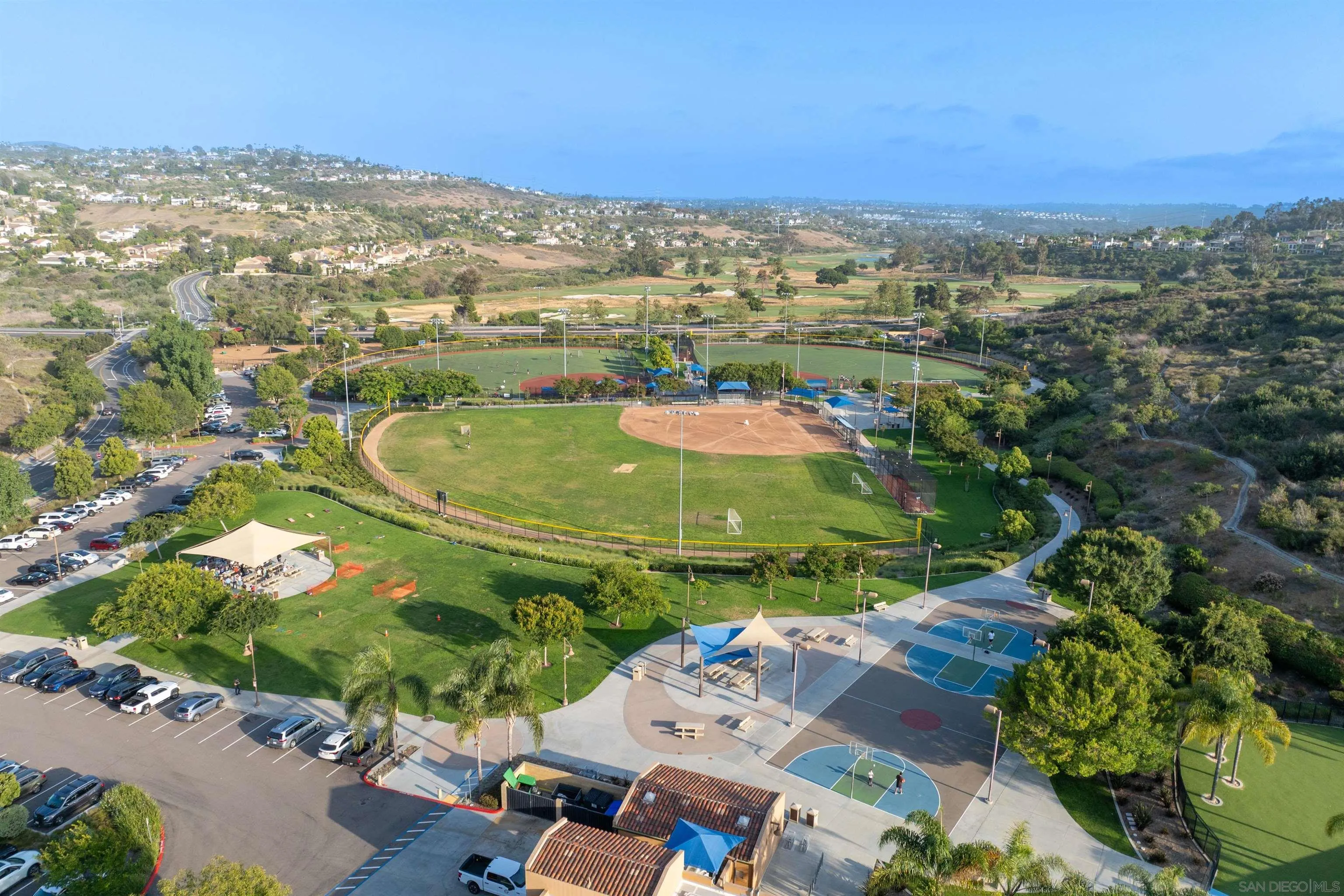2383 Altisma Way, Unit B Carlsbad, CA 92009 - Photo 36 of 38 an aerial view of residential houses with outdoor space and trees