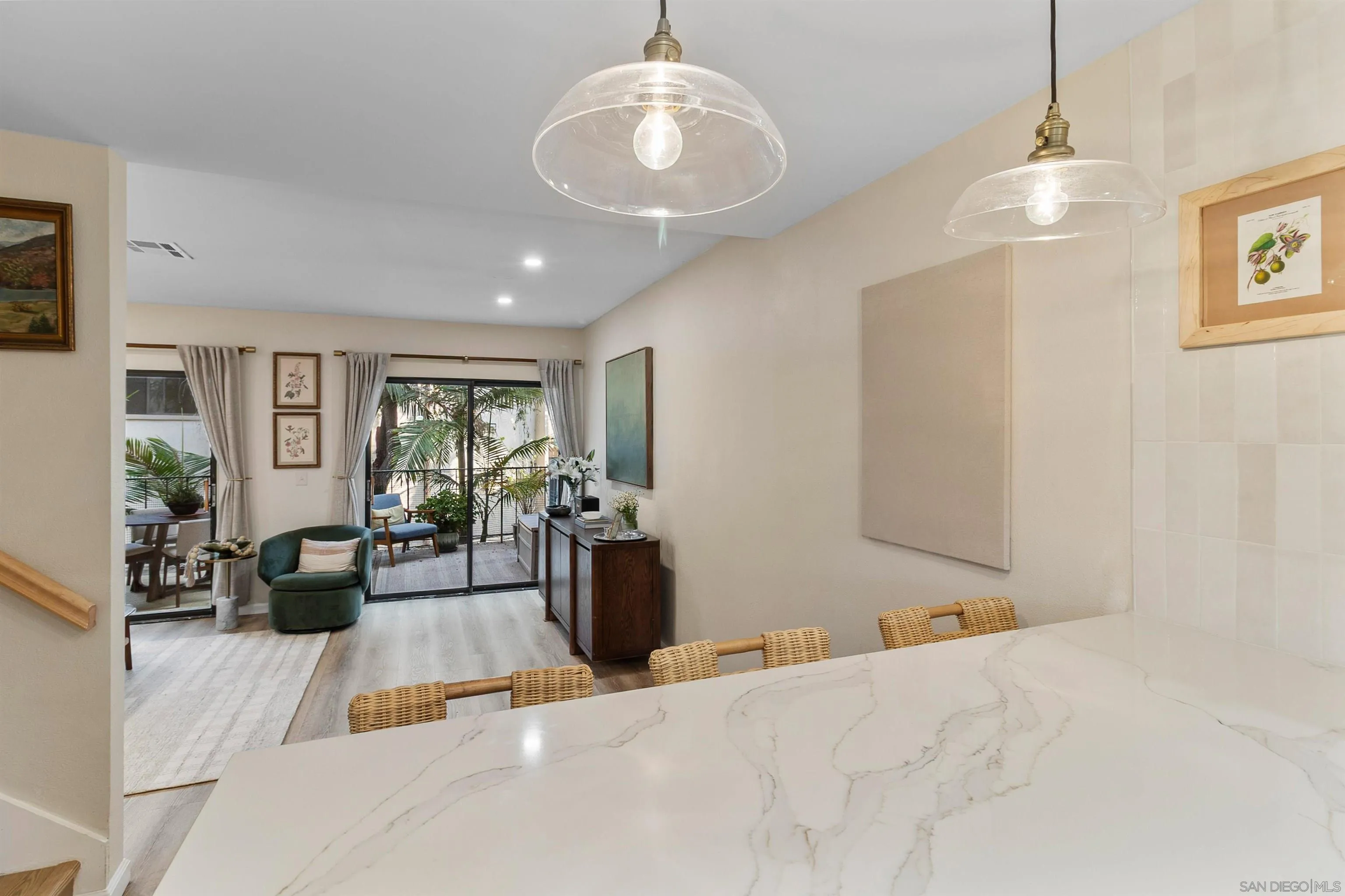 2383 Altisma Way, Unit B Carlsbad, CA 92009 - Photo 8 of 38 a living room with furniture a chandelier and a window