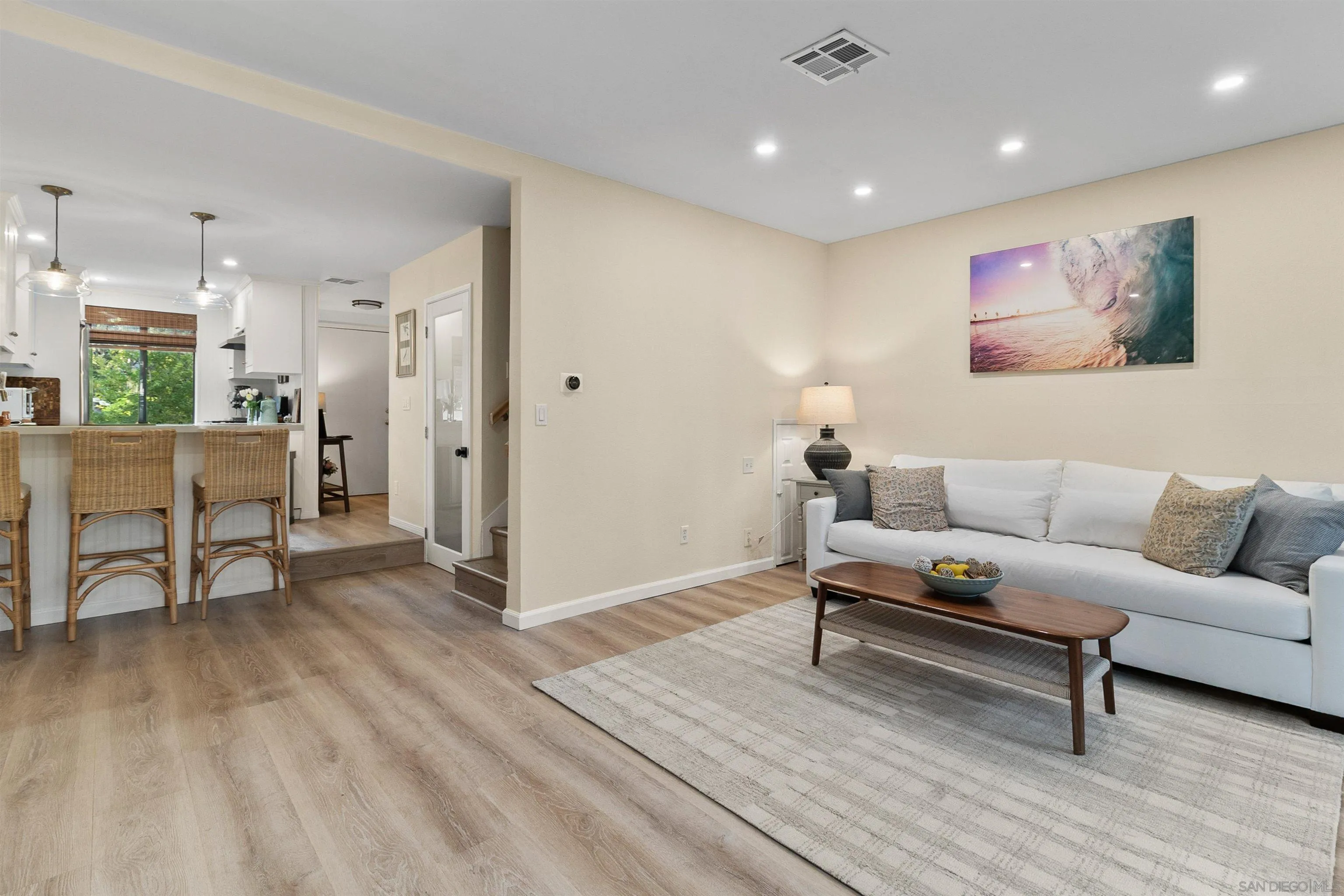 2383 Altisma Way, Unit B Carlsbad, CA 92009 - Photo 9 of 38 a living room with furniture and a wooden floor