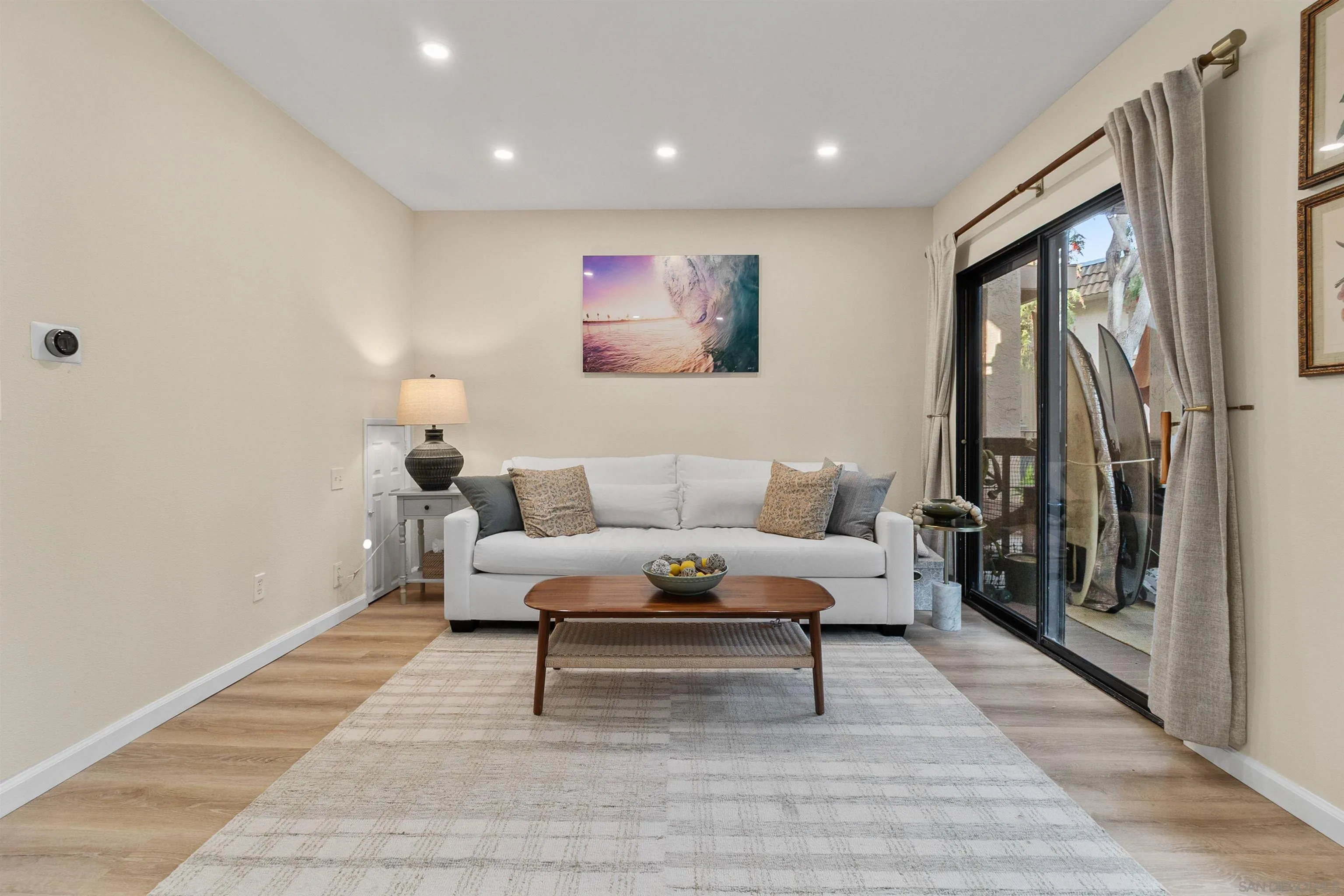 2383 Altisma Way, Unit B Carlsbad, CA 92009 - Photo 10 of 38 a living room with furniture and a rug