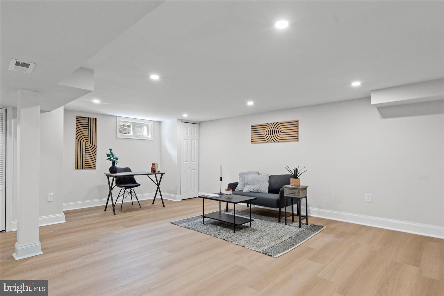 799 Milford Mill Road Baltimore, MD 21208 - Photo 45 of 56 a living room with furniture and a wooden floor