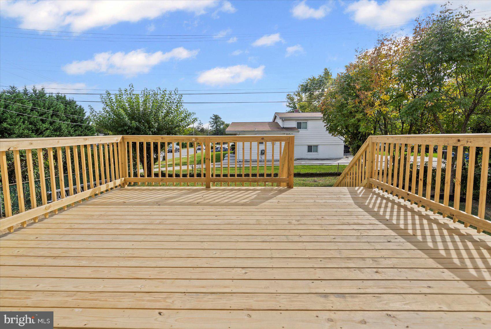 799 Milford Mill Road Baltimore, MD 21208 - Photo 6 of 56 a view of balcony with wooden floor and fence