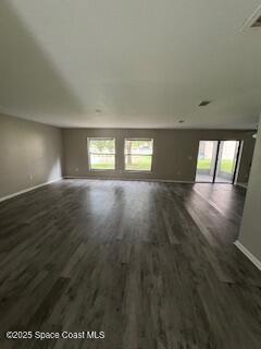 575 Dryden Circle Cocoa, FL 32926 - Photo 6 of 22 an empty room with wooden floor and windows