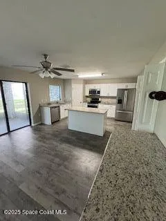 a view of a kitchen with a sink
