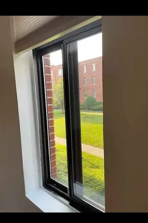 a view of a room with a large window