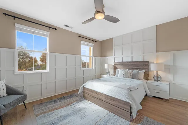 a bedroom with a bed and a couch