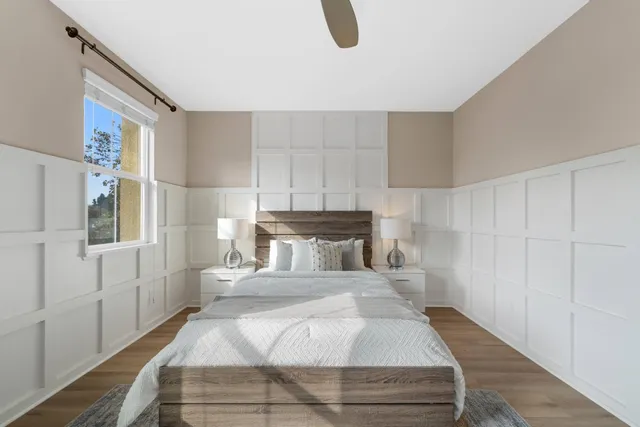 a bedroom with a bed and a window