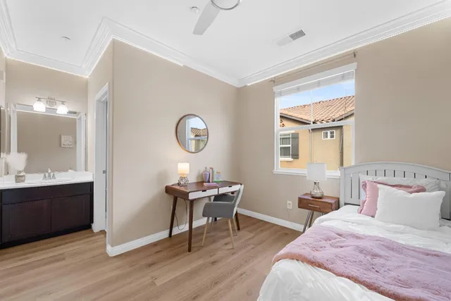 a bedroom with a bed and a table in it