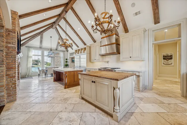 a kitchen with stainless steel appliances granite countertop a stove and a sink