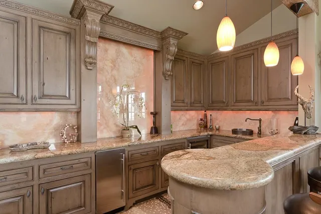 a living room with furniture a large window and a rug