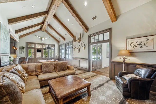 a spacious bedroom with a large bed and a large window