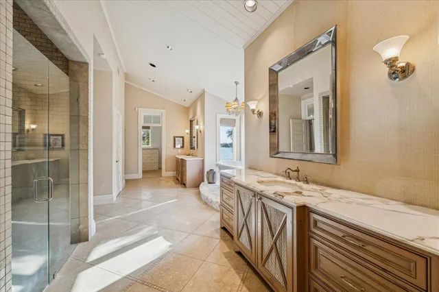an empty room with a ceiling fan and windows