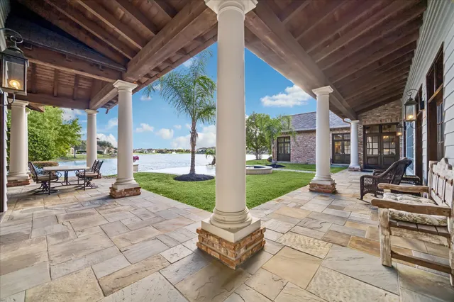 a view of a house with pool table and chairs