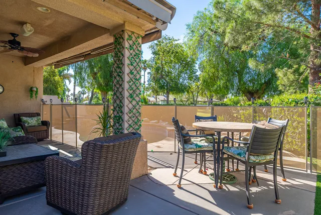 a view of a patio in a backyard