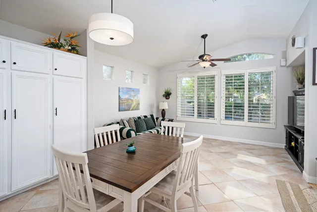 a view of a dining room with furniture window and outside view