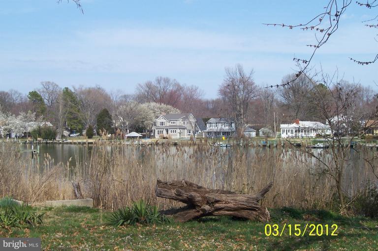1097 Rodgers Road Churchton, MD 20733 - Photo 3 of 6 a view of a lake with a mountain in the background