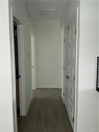 a view of a bathroom from the hallway