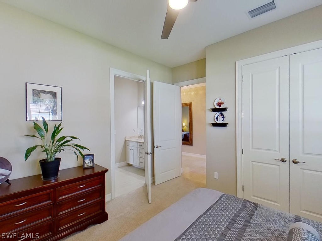 8920 Rails End Court Fort Myers, FL 33919 - Photo 12 of 35 a living room with furniture and a potted plant