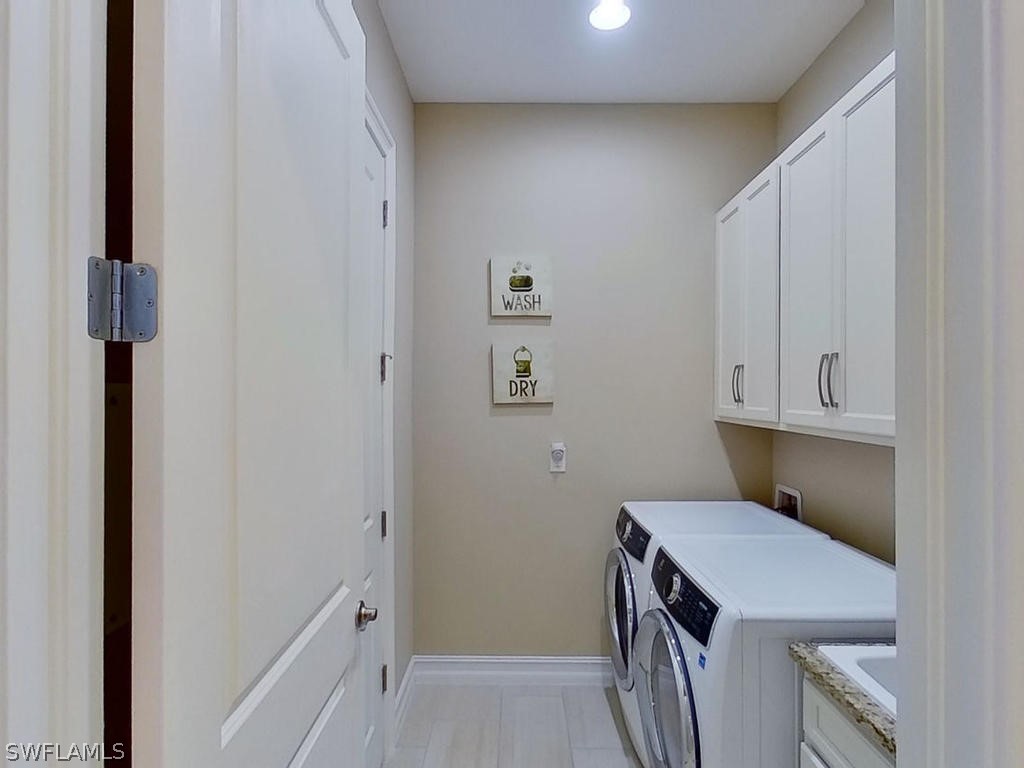 8920 Rails End Court Fort Myers, FL 33919 - Photo 16 of 35 a room with storage and utility