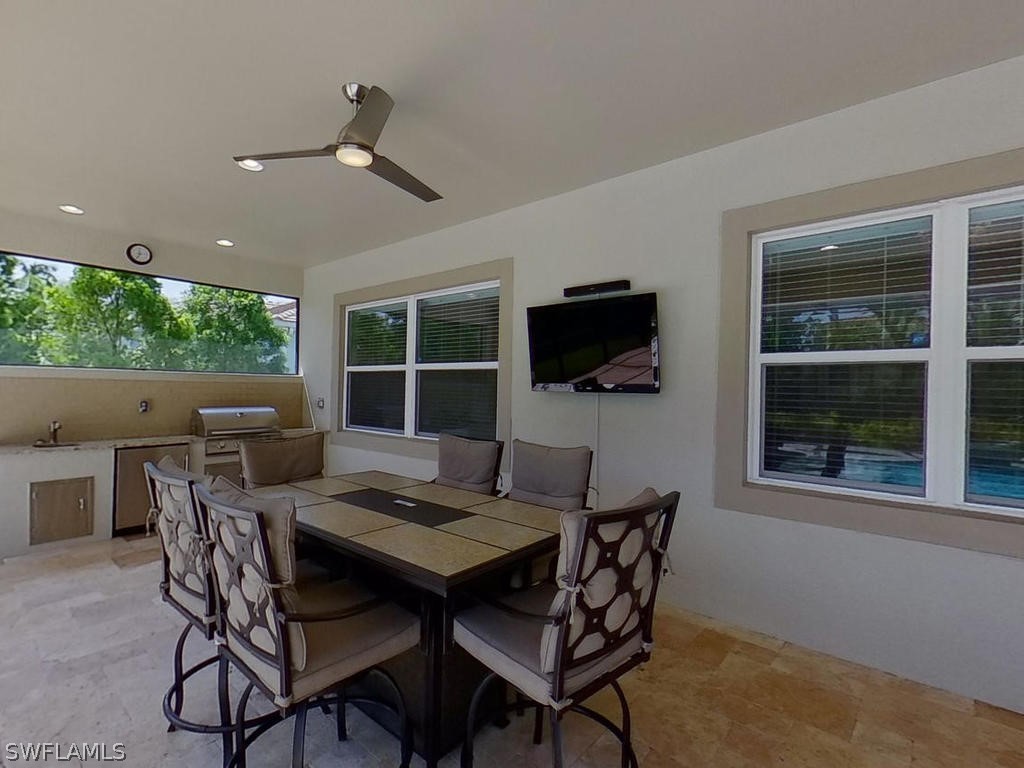 8920 Rails End Court Fort Myers, FL 33919 - Photo 19 of 35 a view of a dining room with furniture window and wooden floor