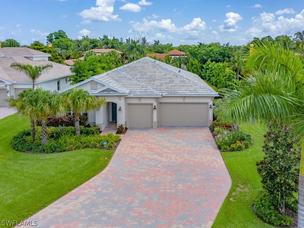 8920 Rails End Court Fort Myers, FL 33919 - Photo 2 of 35 a house with green field in front of it