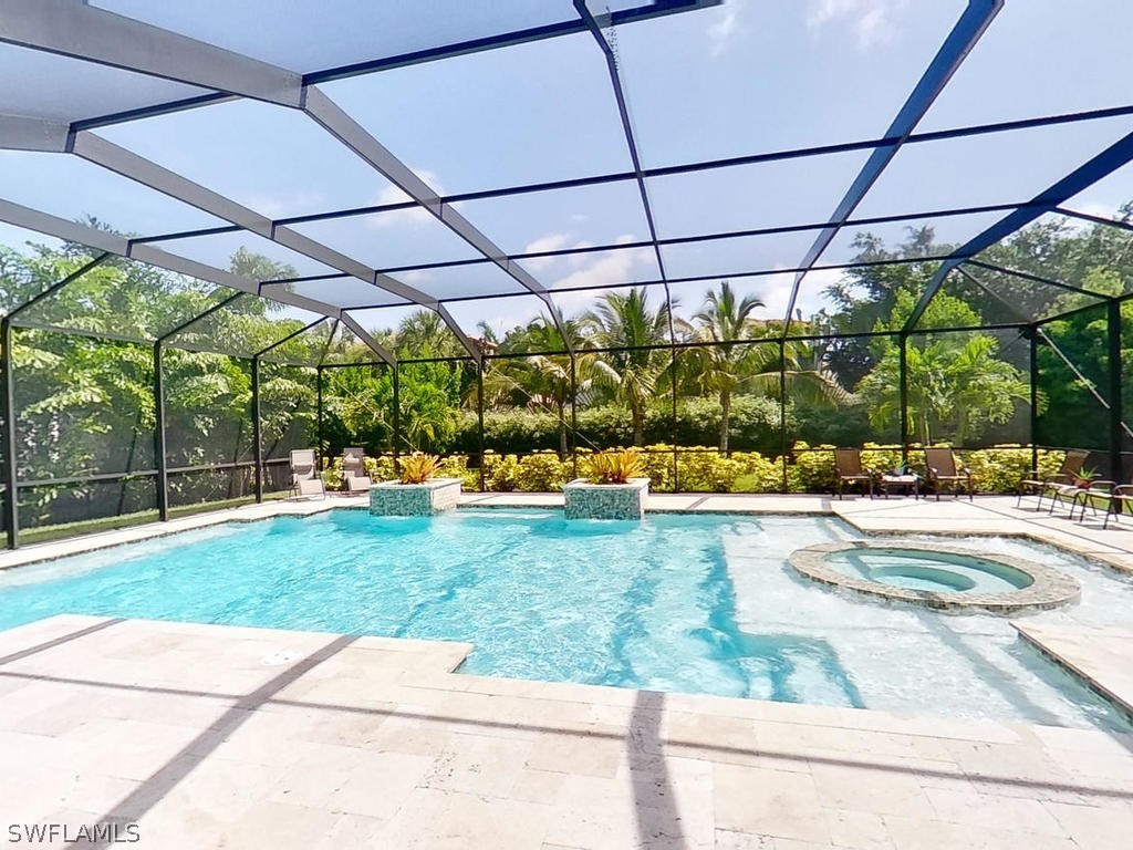8920 Rails End Court Fort Myers, FL 33919 - Photo 21 of 35 a view of a swimming pool with a patio