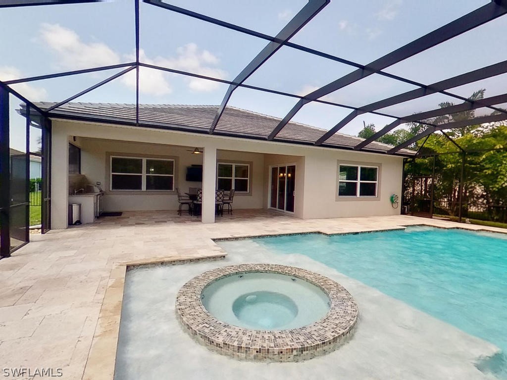 8920 Rails End Court Fort Myers, FL 33919 - Photo 23 of 35 a view of a house with a backyard