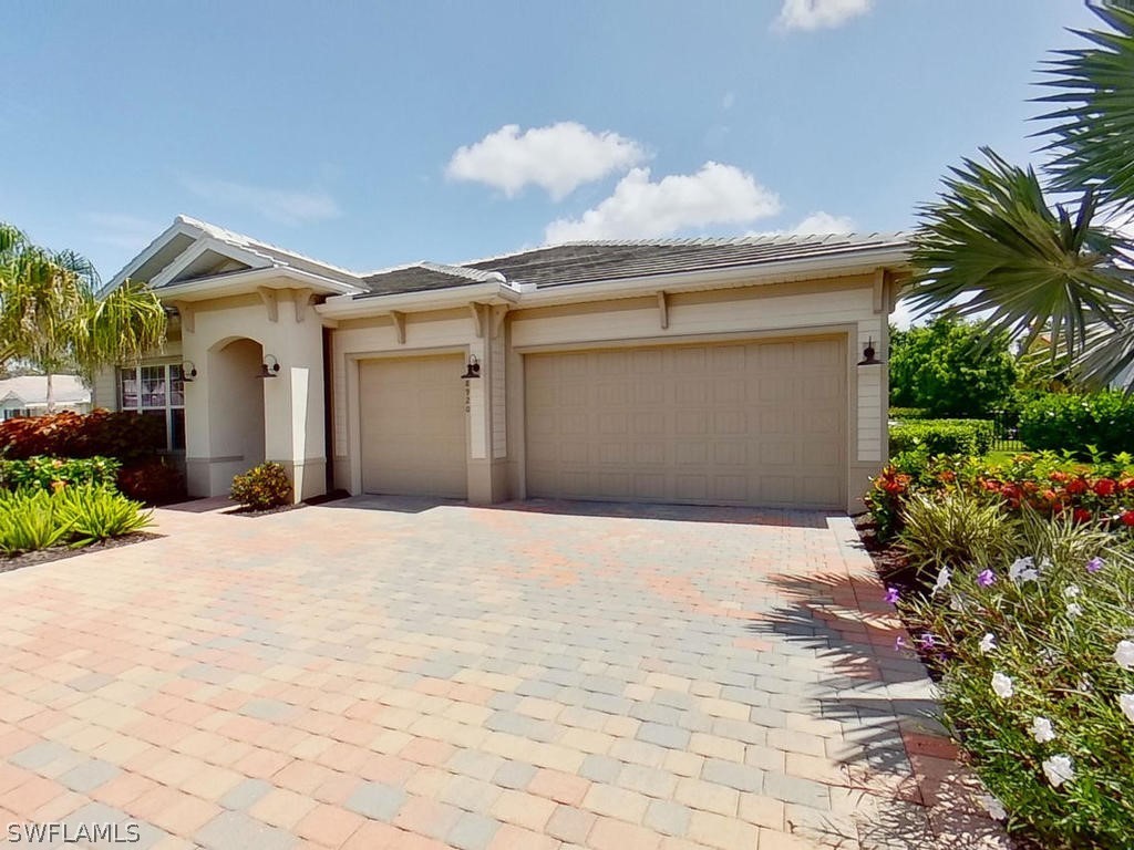 8920 Rails End Court Fort Myers, FL 33919 - Photo 26 of 35 a view of garage and yard
