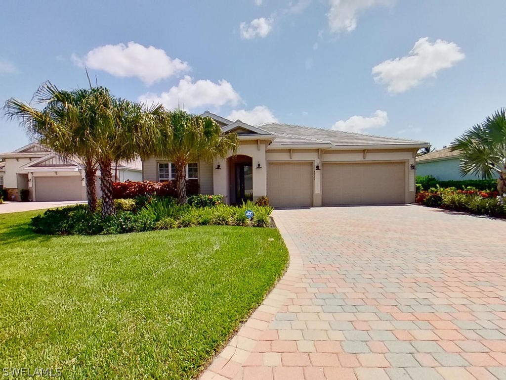 8920 Rails End Court Fort Myers, FL 33919 - Photo 27 of 35 a front view of a house with garden