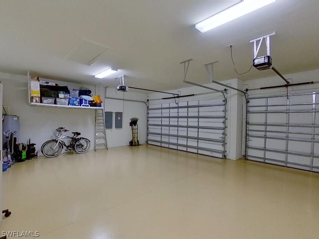8920 Rails End Court Fort Myers, FL 33919 - Photo 28 of 35 a view of a garage with storage