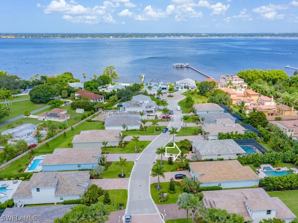 8920 Rails End Court Fort Myers, FL 33919 - Photo 29 of 35 an aerial view of a house with a garden and lake view