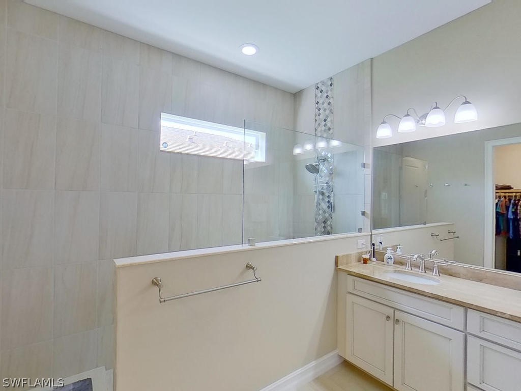 8920 Rails End Court Fort Myers, FL 33919 - Photo 10 of 35 a bathroom with a sink and a mirror