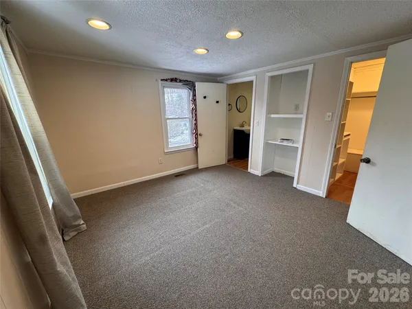 a bathroom with a sink a mirror and a shower