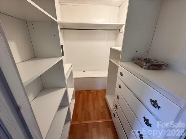 a bathroom with a sink toilet and mirror