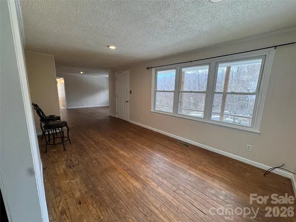 a kitchen with stainless steel appliances granite countertop a refrigerator and a stove