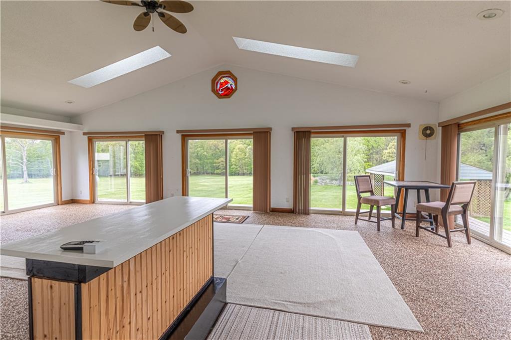 166 Ed Lees Lane Kennerdell, PA 16374 - Photo 22 of 46 Sun room with windows and sliding door all around