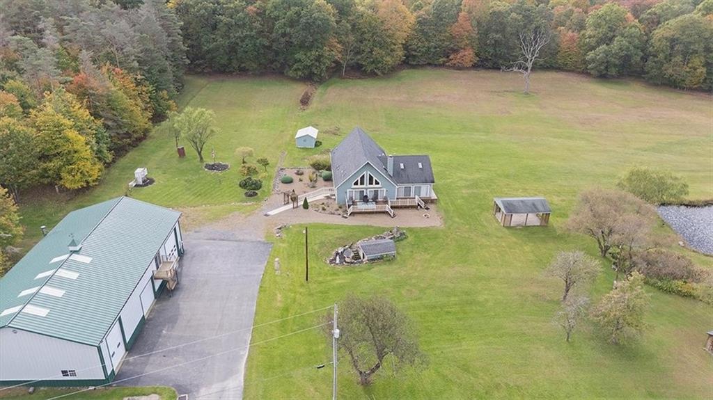 166 Ed Lees Lane Kennerdell, PA 16374 - Photo 44 of 46 Aerial view coming into the property. Driveway/garage on left, home straight ahead and ponds to the right