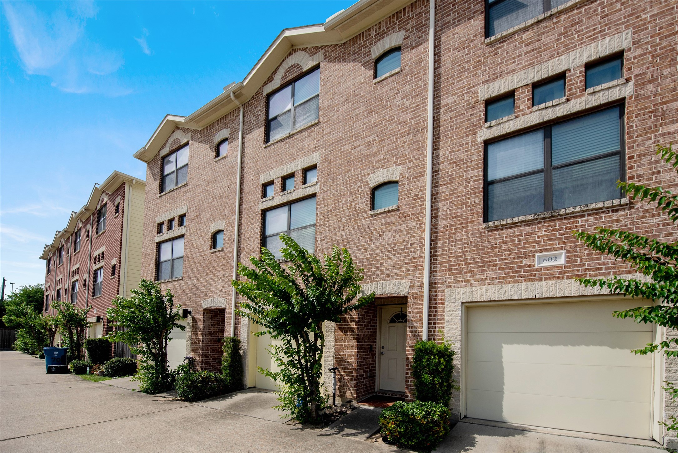 7650 Springhill Street, Unit 603 Houston, TX 77021 - Photo 2 of 26 a front view of a house with a yard