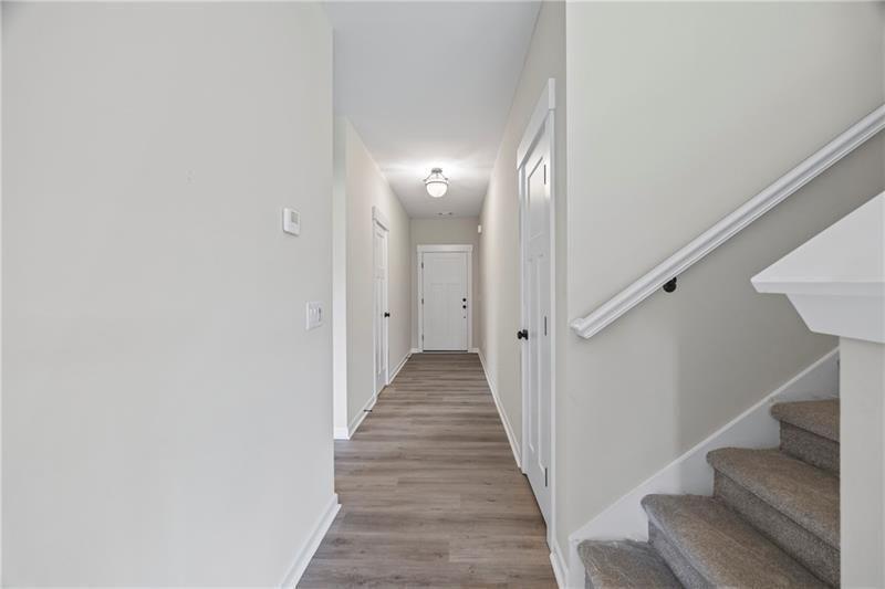 693 Racetrack Road Toccoa, GA 30577 - Photo 6 of 45 a view of a hallway with wooden floor and entryway