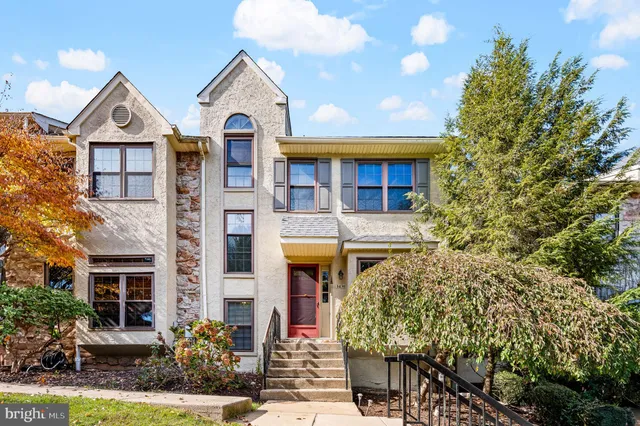 a front view of a house with yard