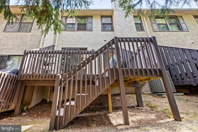 a view of balcony with wooden floor and outdoor seating